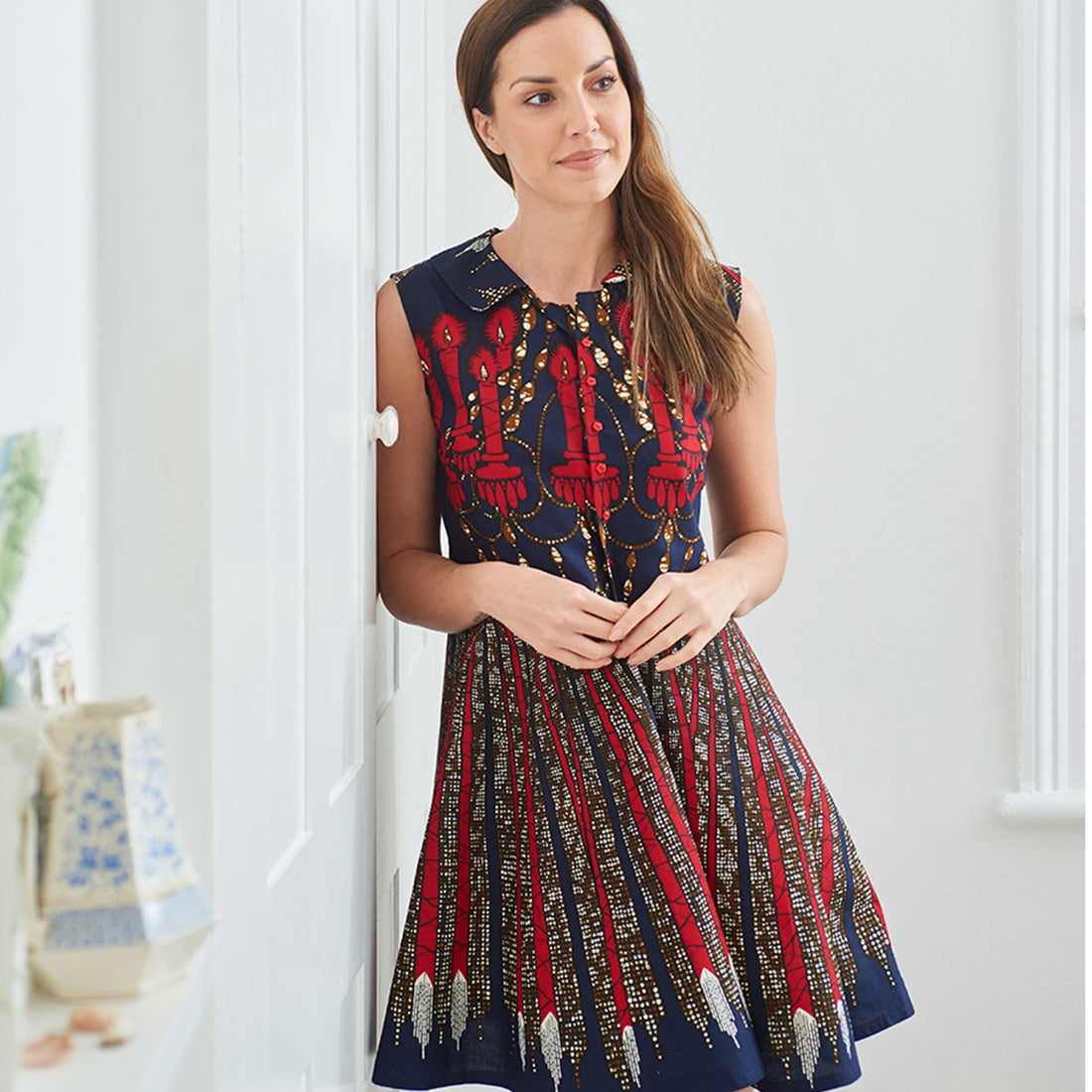Model wearing the 'Etta' dress in African wax print fabric from Dovetailed London.