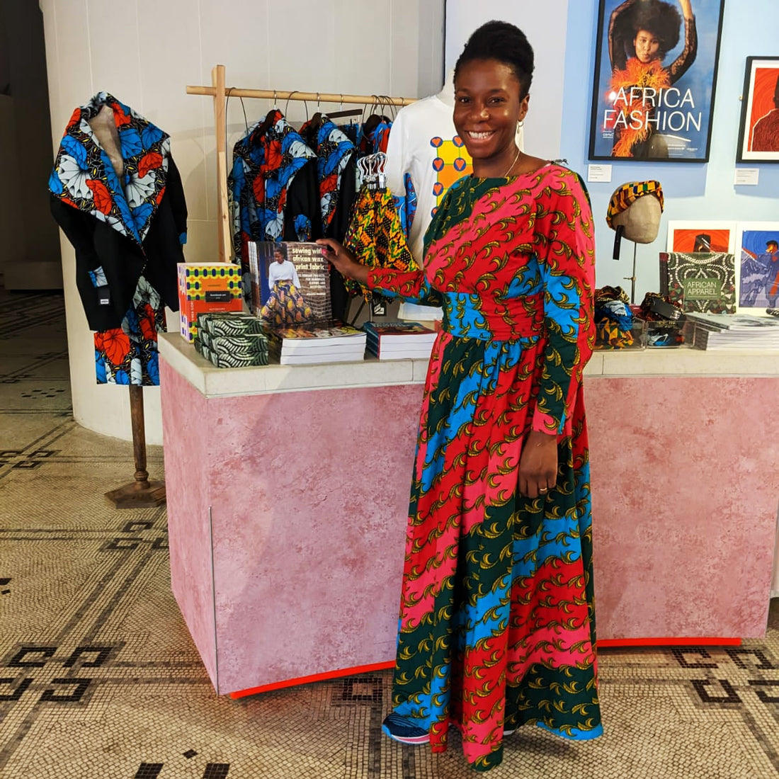 Adaku wearing an African print wax dress at the Africa Fashion exhibition at the V&A Museum