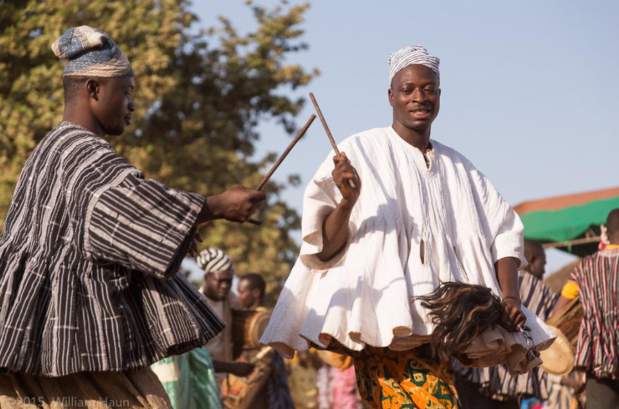 Image showing a dancers twirl and alternate clicking iron rods with dancers.