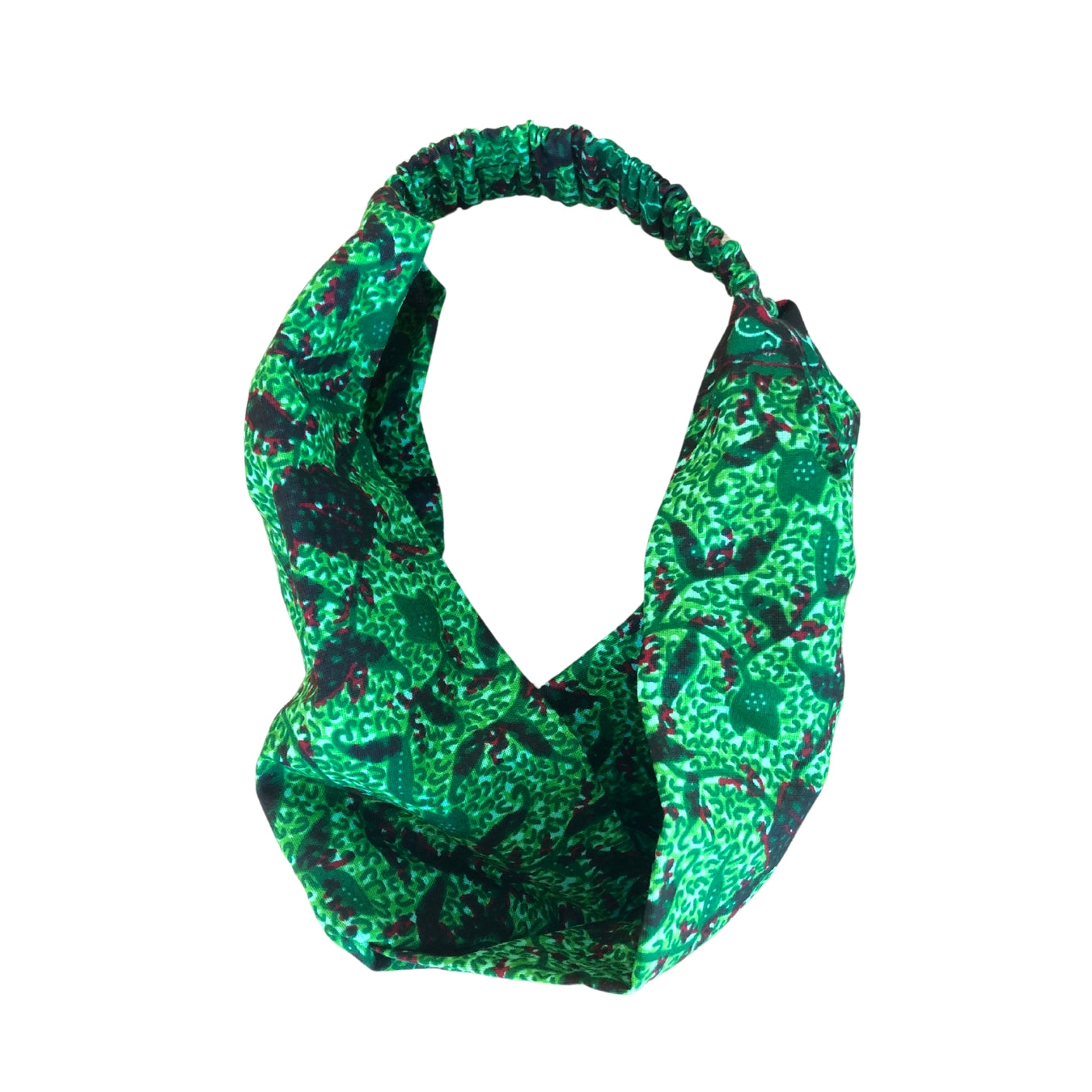 A green patterned headband on a white plain background.