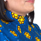 A side close-up view captures the details of the neckline of the blue dress, adorned with yellow elements.