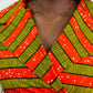 A close-up of an orange-striped dress, with a focus on the top part of the garment, specifically the elegant V-neck design and the accompanying tie belt. This image highlights the intricate details of the neckline and the stylish tie belt, showcasing the chic features of the dress.