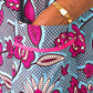 A close up of the pockets of the blue/ pink print elements, highlighting the comfortability of the dress.