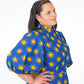 Side view of model wearing the  blue puff sleeve long dress, adorned with vibrant yellow elements.