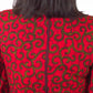 A rear view of the red dress, showcasing the zipper closure at the back.