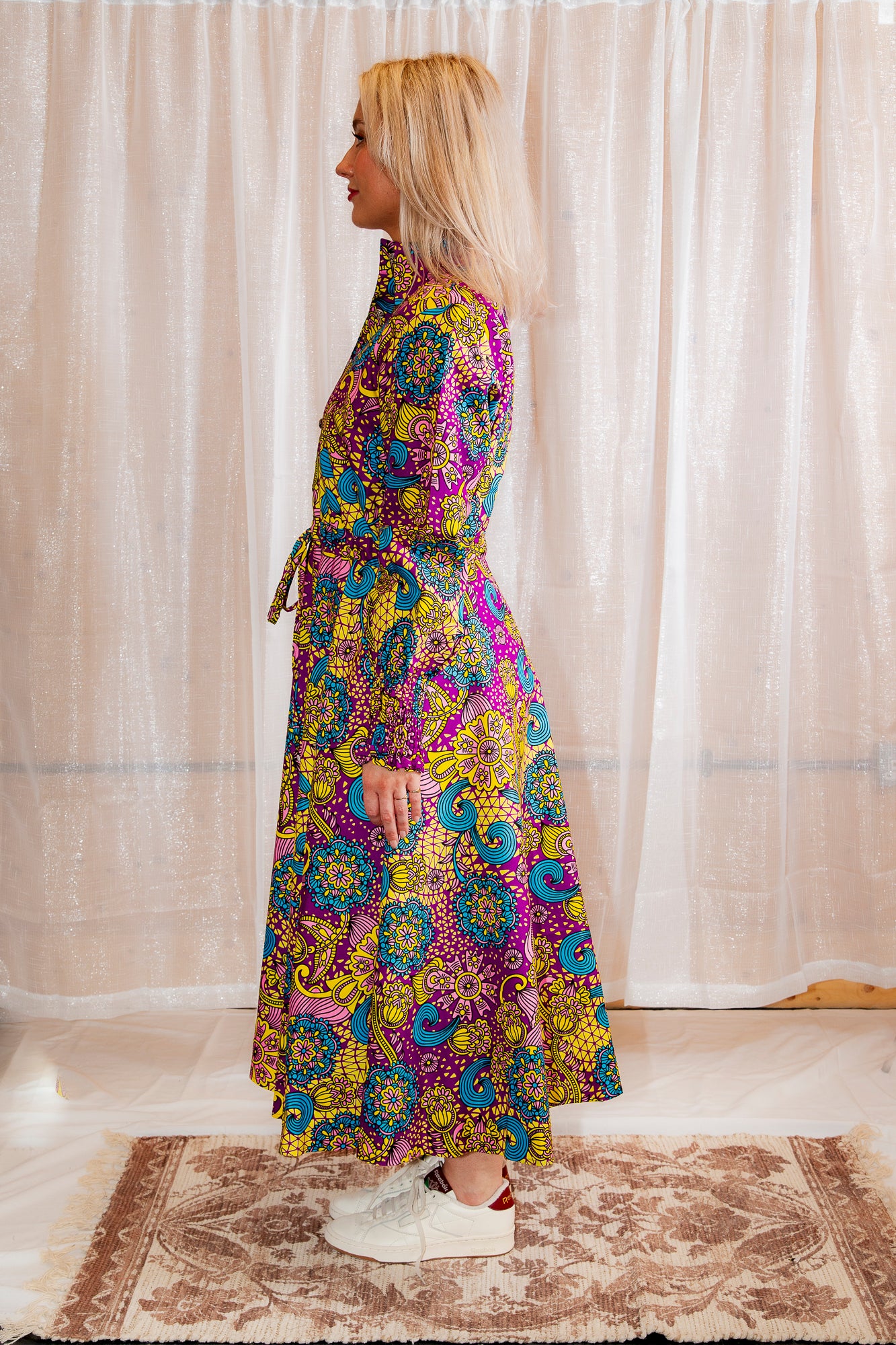 Model posing in Onyeka African Print Shirt Dress Purple Ankara Dress Clothes side view