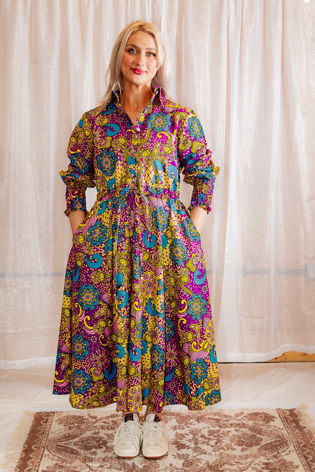 Model posing in Onyeka African Print Shirt Dress in Purple