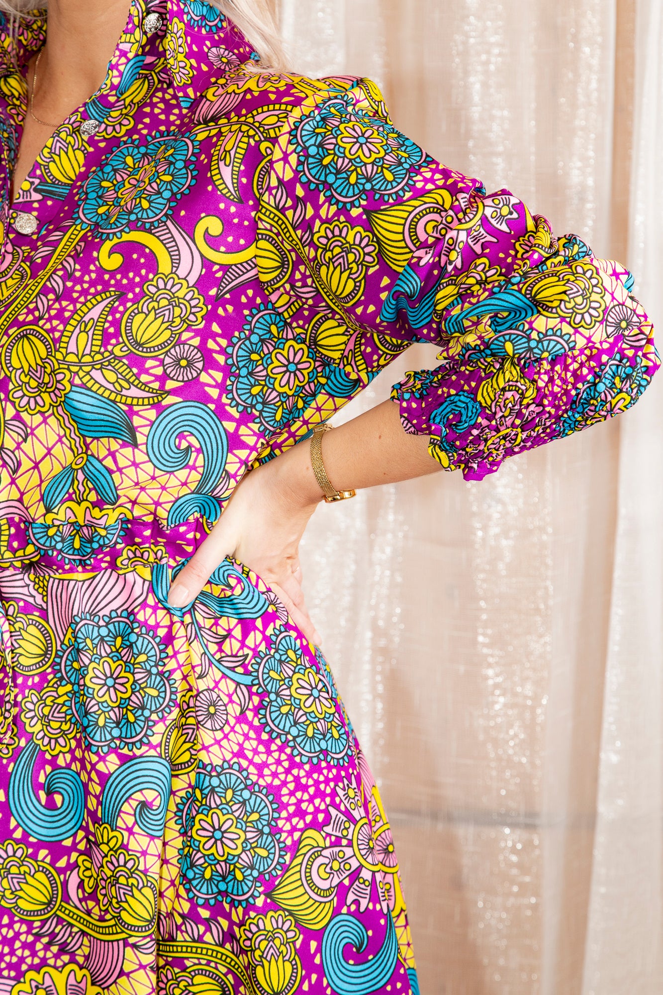 Model posing in Onyeka African Print Shirt Dress in Purple