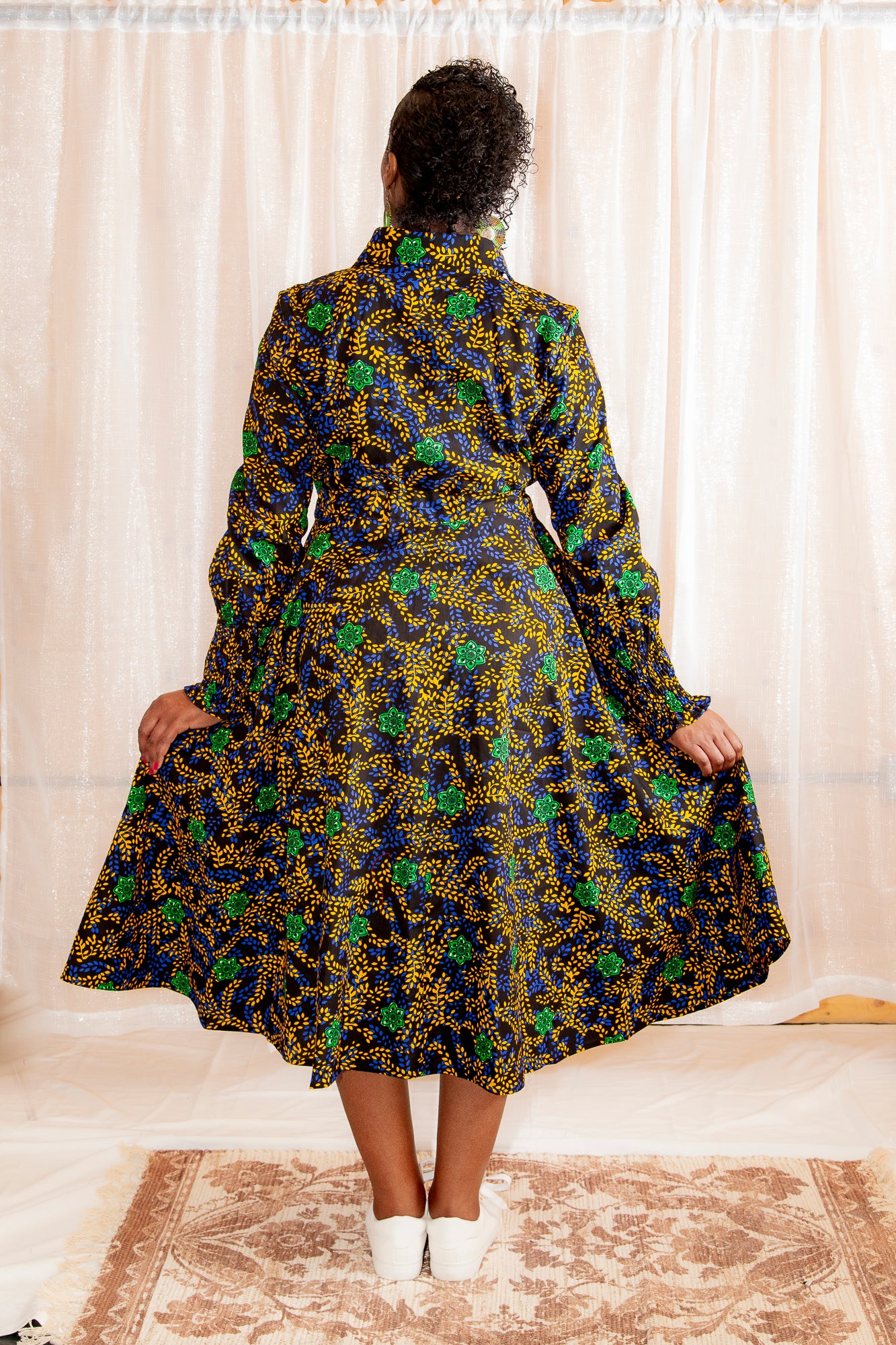 The back of a model posing Onyeka African Print Shirt Dress Black Ankara Dress Clothes