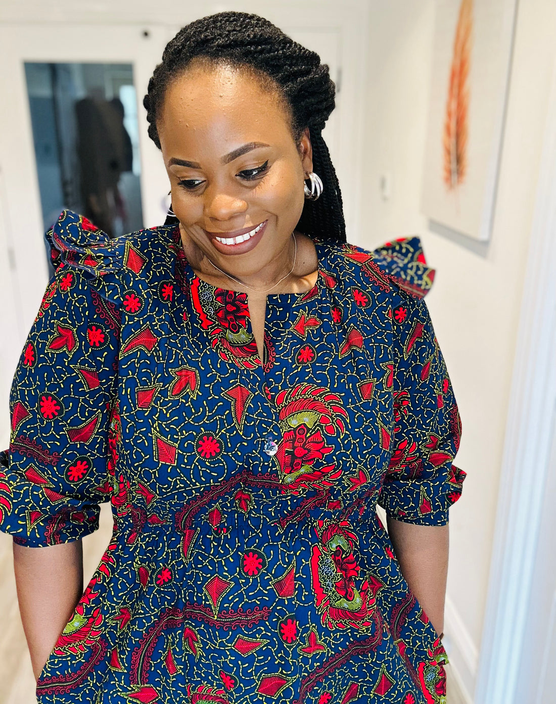   Anastacia Ogundare showcasing a bold ‘hack of the Anthea Blouse / dress by Anna Allen Patterns and the Davenport Dress by the Friday Pattern Company’  crafted with African print fabric from Dovetailed London, combining fashion and culture seamlessly."