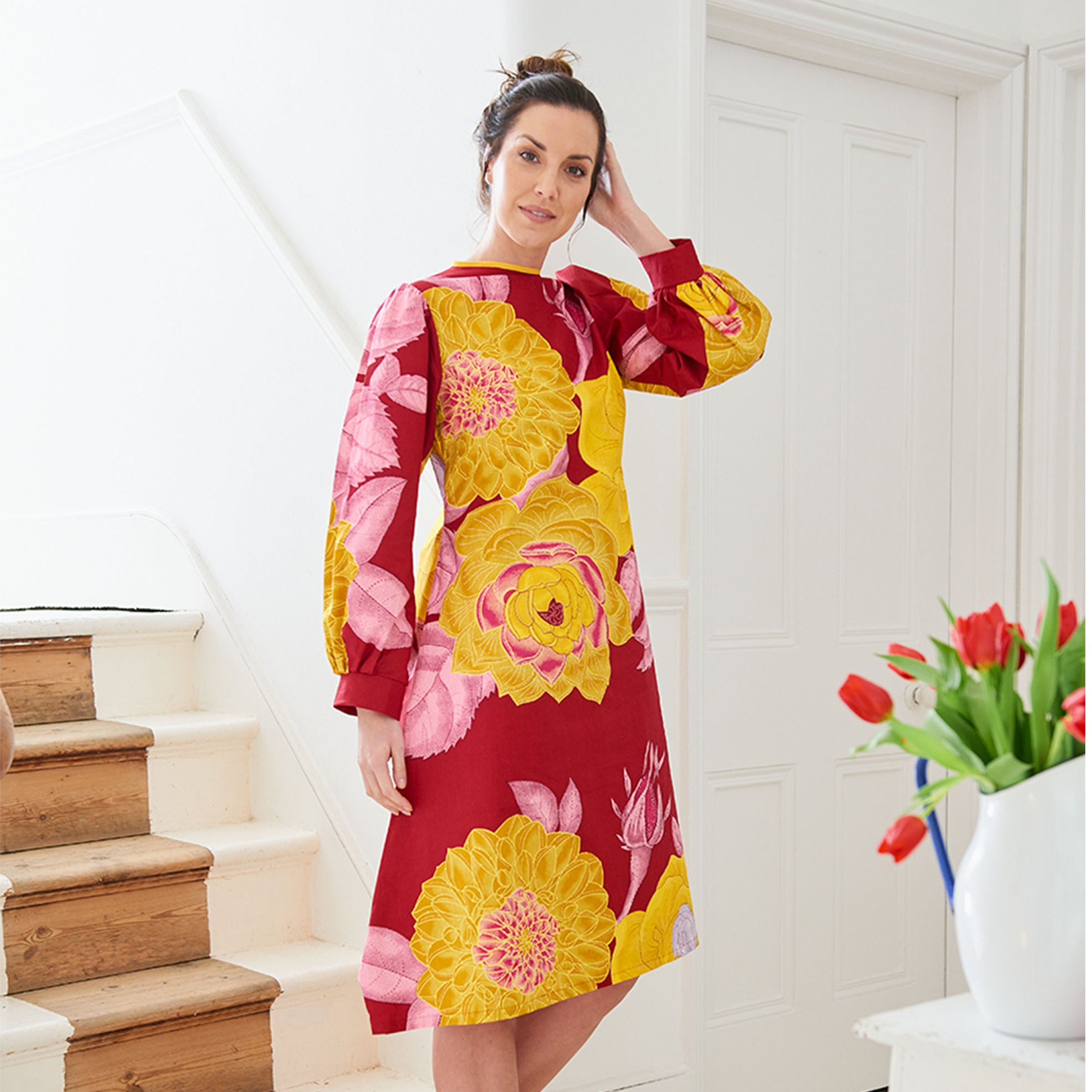 Model wearing the 'Betsy' dress in African wax print fabric from Dovetailed London.