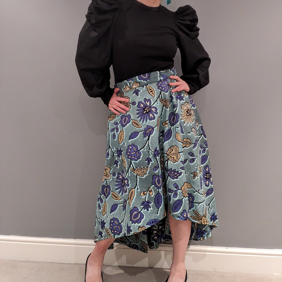 Dovetailed London's brand ambassador wearing a self drafted skirt in African wax print from Dovetailed London
