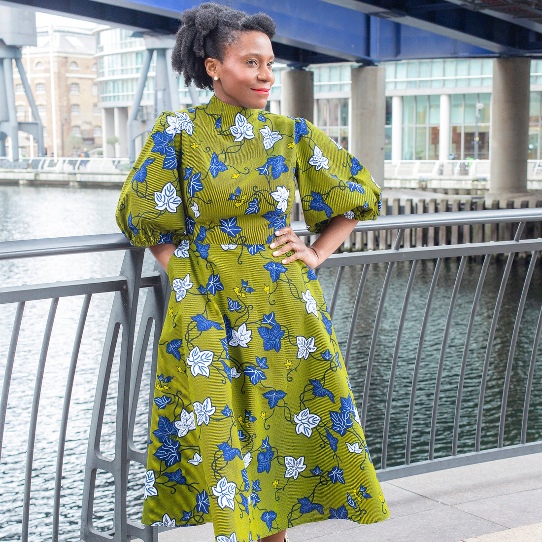 Adaku showcasing the Camille African Print Puff Sleeve Dress Khaki in African wax print by Dovetailed London