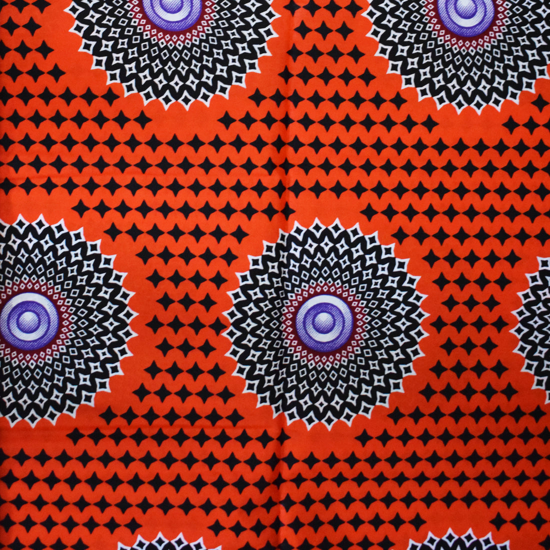 African motifs and symbols are wax printed onto cotton.