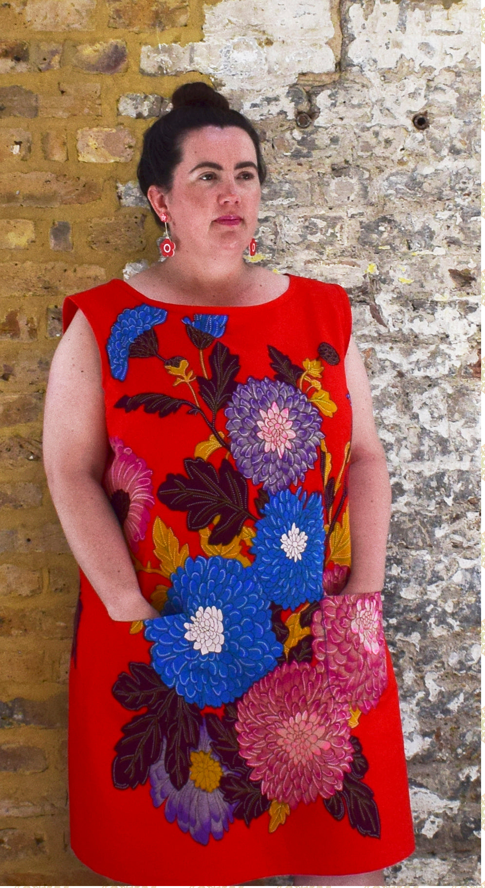 Model wearing the 'Meghan' dress in African wax print fabric from Dovetailed London.