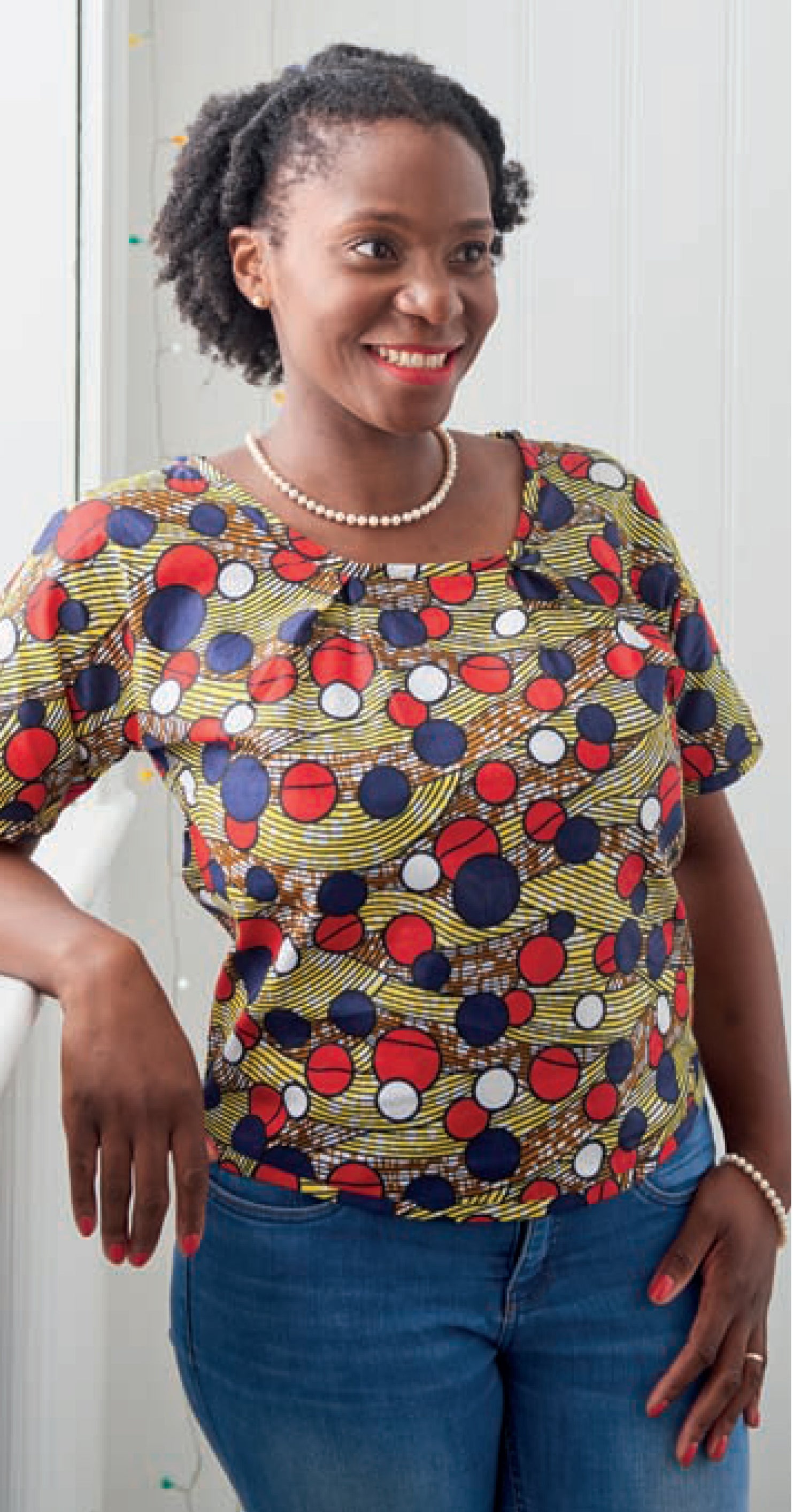 Adaku wearing the 'PRISCILLA TOP' in African print wax from Dovetailed London.