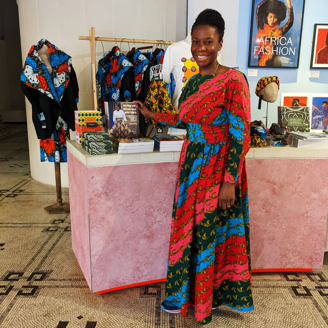 Adaku wearing an African print wax dress at the Africa Fashion exhibition at the V&A Museum 