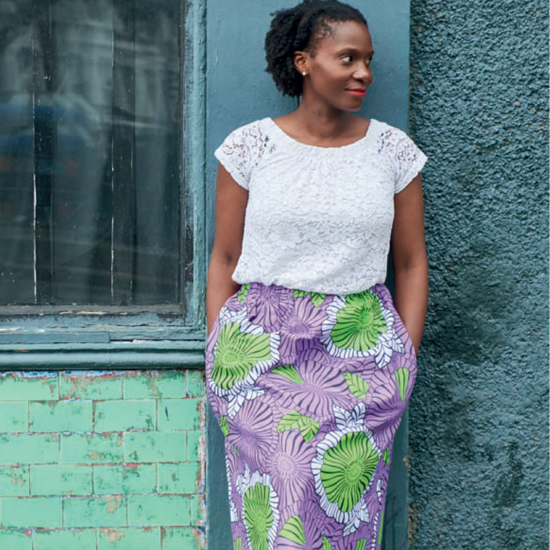 Adaku wearing the 'Althea' skirt in African print wax fabric from Dovetailed London.
