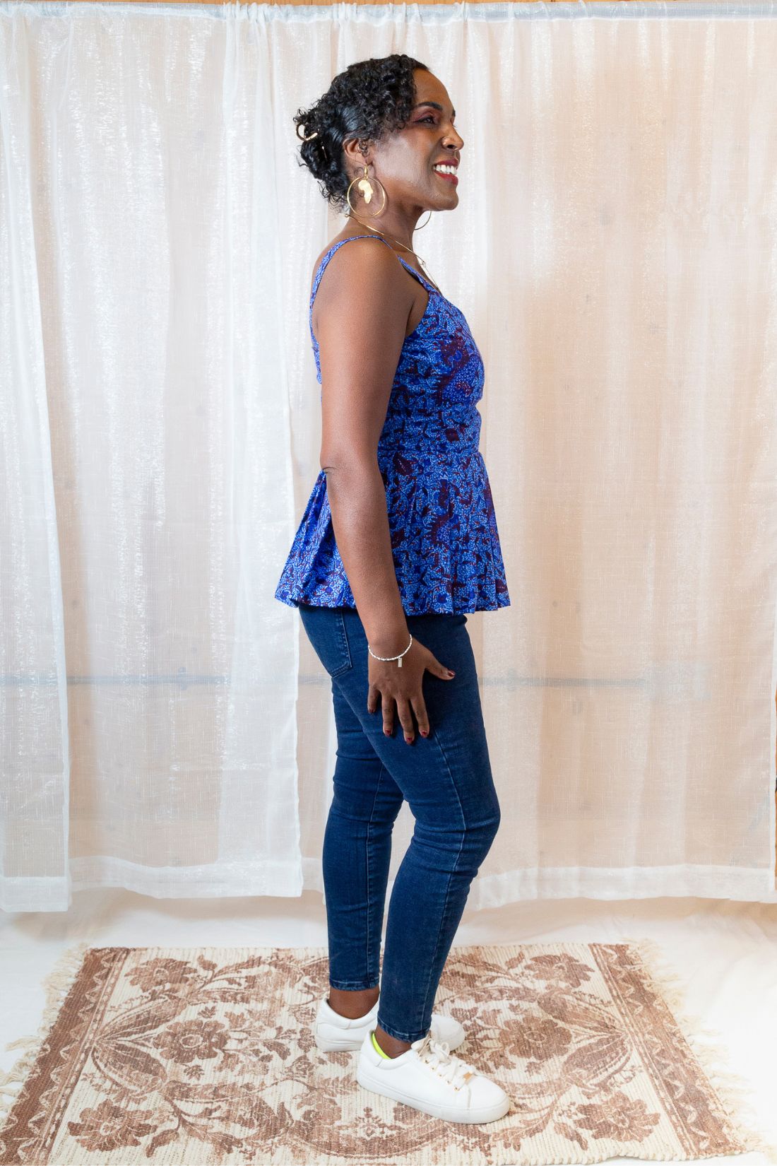 A woman wearing a blue floral top 