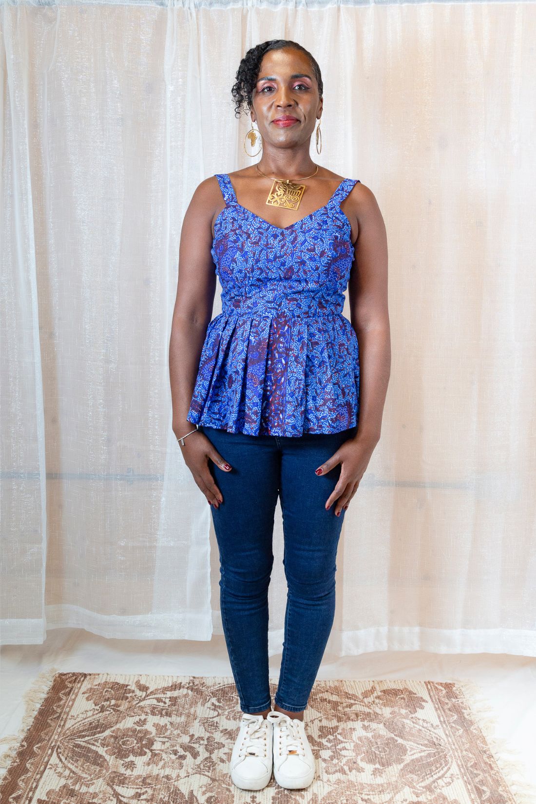 A woman wearing a blue floral top 