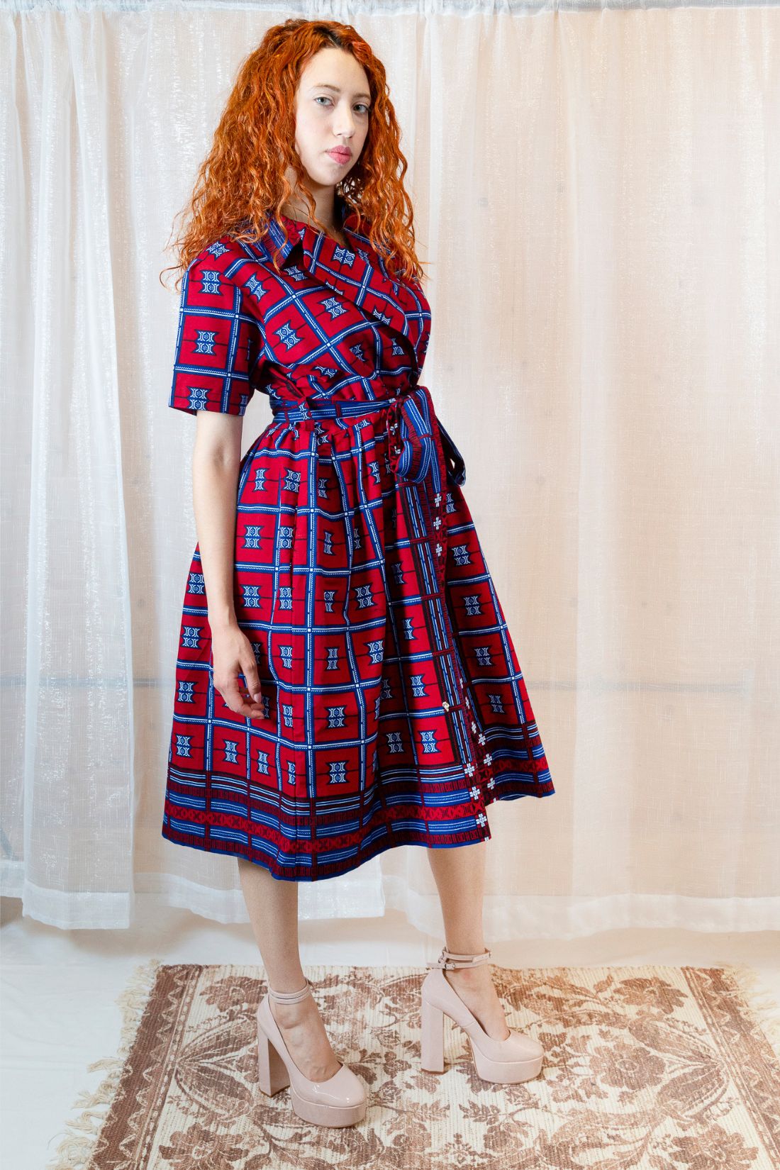 A person in a red and blue checkered dress