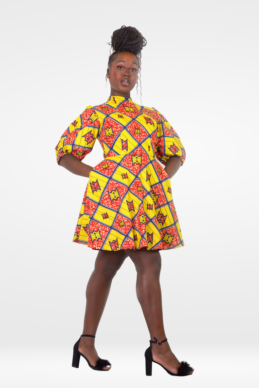 Model posing in Camille African Print Puff Sleeve Knee-Length Dress Yellow Ankara.