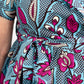 A detailed view of the print tie belt adorned on the dress, tied into a cute bow.