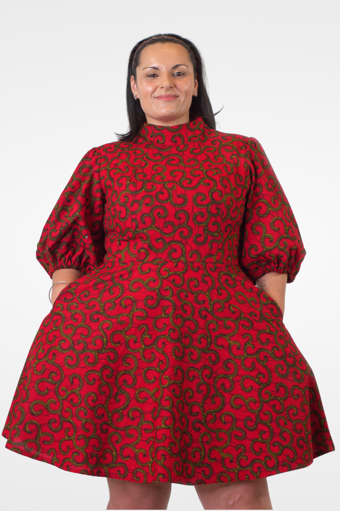 Model posing in Camille African Print Puff Sleeve Knee-Length Dress Red Ankara Dress.