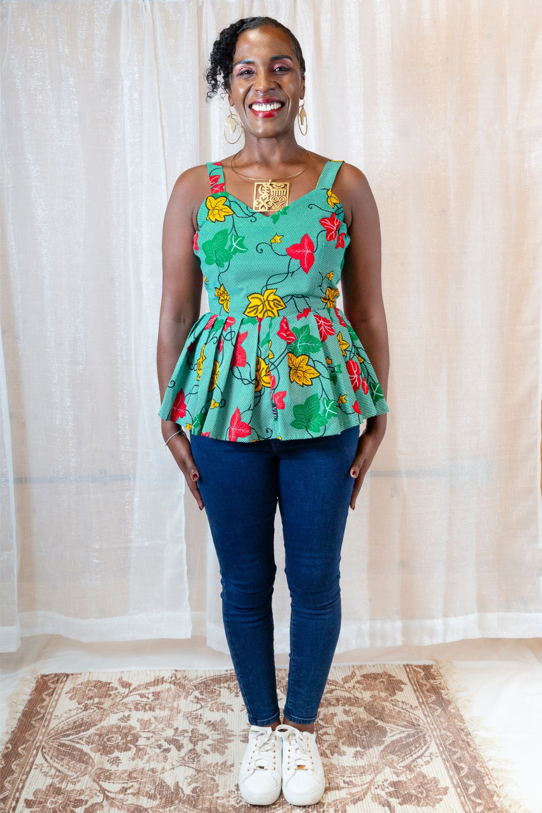 A woman wearing a green floral top