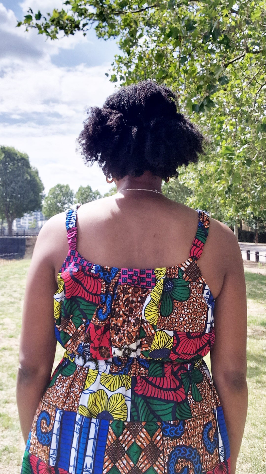 A close up of the back of the straps of the patchwork maxi dress.