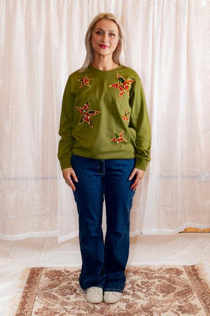 Model posing in African Print Ankara Green Stars Cotton-Blend Sweatshirt.