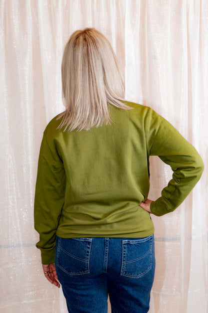 Model showing back of African Print Ankara Green Stars Cotton-Blend Sweatshirt.