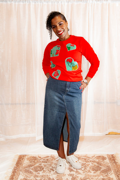 Model posing in African Print Ankara Red Hearts Cotton-Blend Sweatshirt.